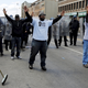 Community members stand between protestors and law enforcement. (Reuters/Jim Bourg)